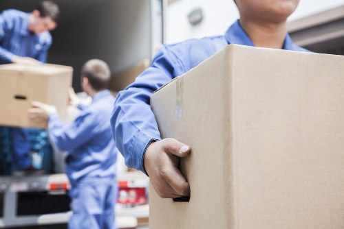 Professional office removals in Queenspark with packed boxes and workplace relocation planning