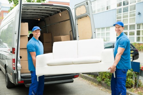 Furniture pick-up service removing bulky sofa in Queenspark