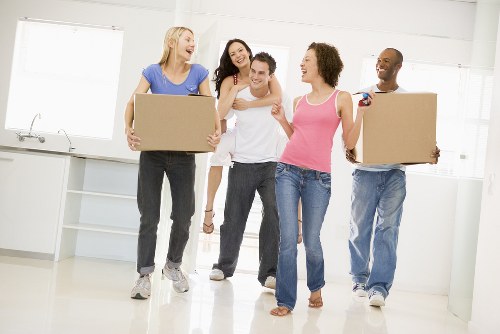 Professional house removalists loading furniture in Queenspark