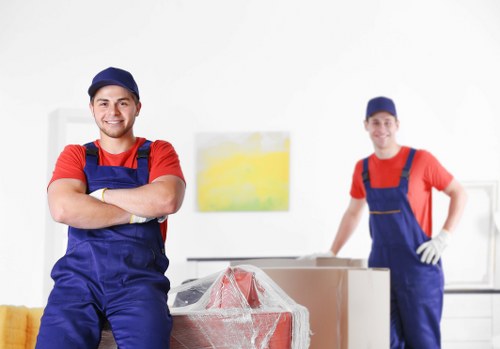 Professional removal team loading furniture in Queenspark