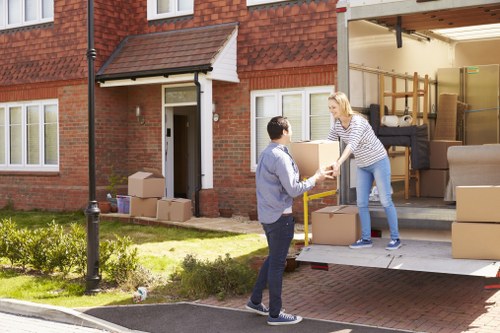 Packed living room items prepared for a Queens Park house move