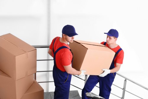 Removal team preparing boxes and equipment safely before a move