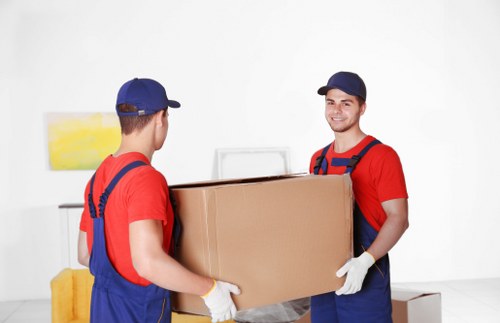 House movers loading furniture for a Queens Park home move