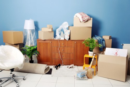 Professional movers handling furniture packing and loading