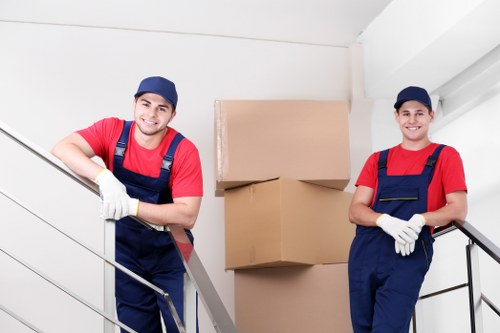 Staff using proper lifting techniques during a house removal