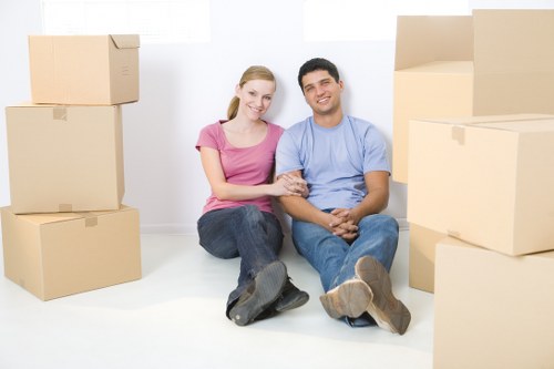 Removal crew handling furniture carefully during relocation