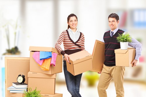 Local moving team handling boxes for a Queenspark relocation