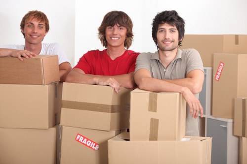 A moving team coordinating a commercial Queenspark removals relocation