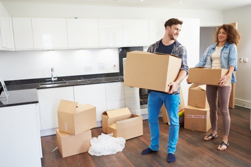 Queenspark moving team packing household items carefully