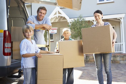 Packed moving boxes and furniture for Queens Park removals