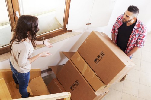 Packed household items prepared for a Queens Park removal
