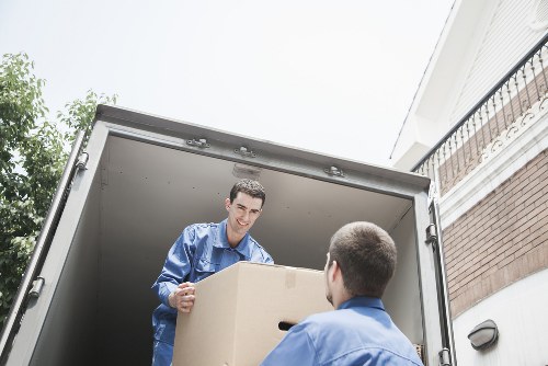 Professional movers handling a flat removal in Queens Park